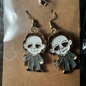 Gold and Gray Horror Character Earrings